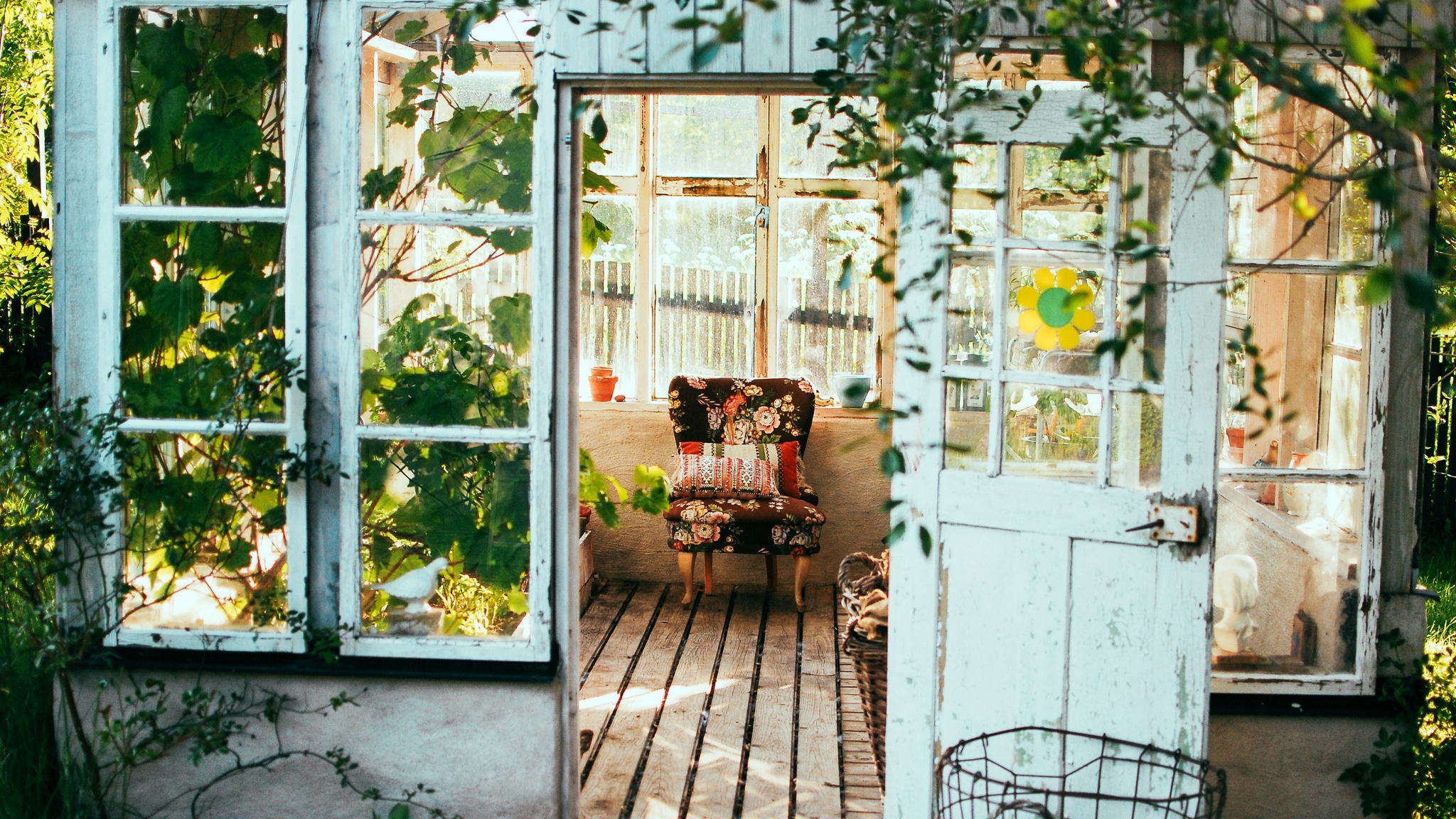 Greenhouse with colorful folding chair