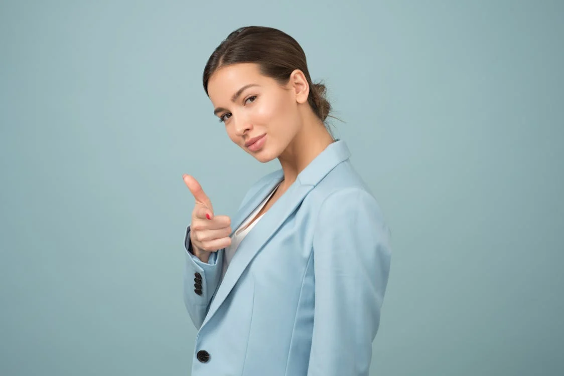 Woman wearing blue shawl lapel suit jacket