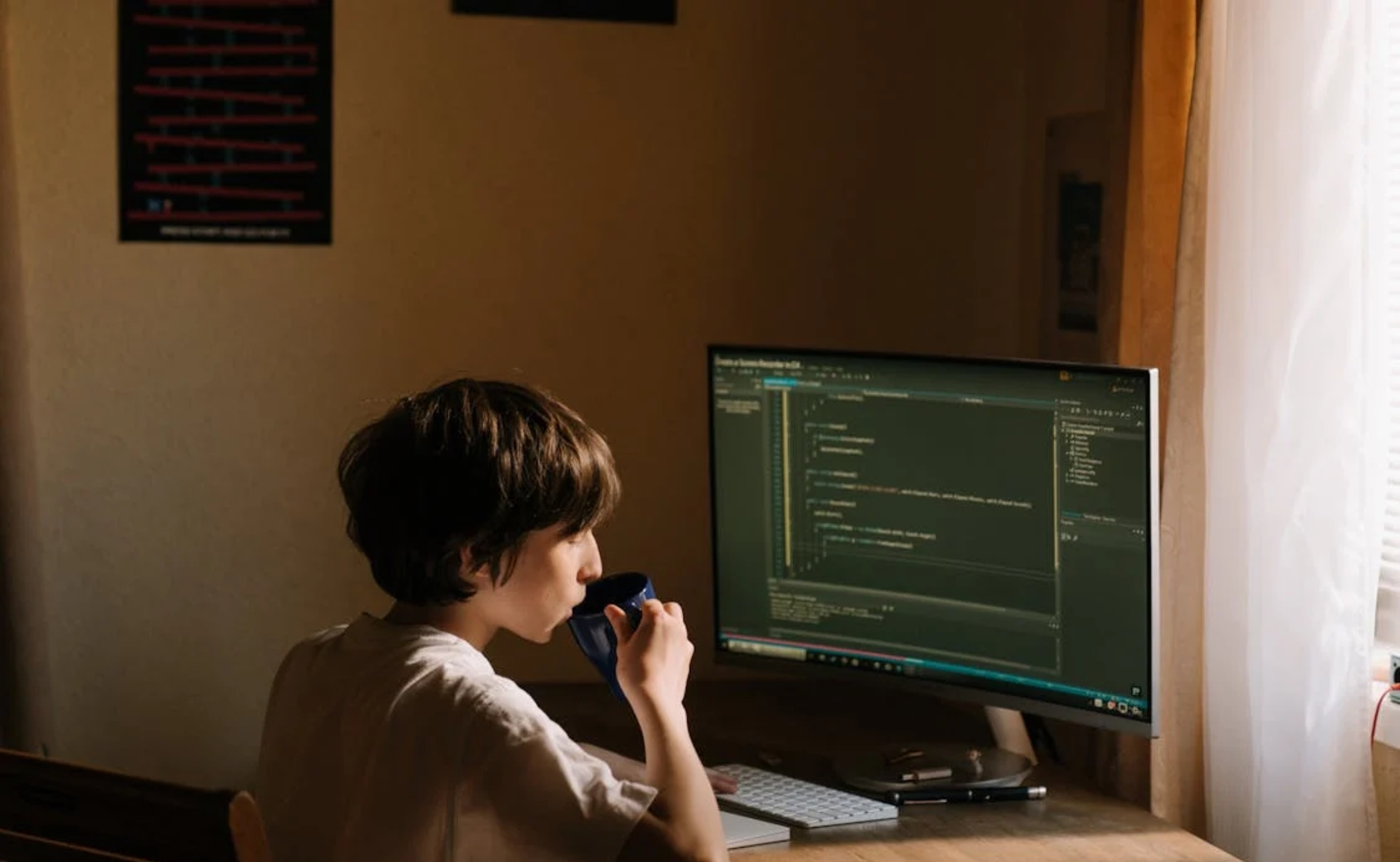 people sitting on chair in front of computer