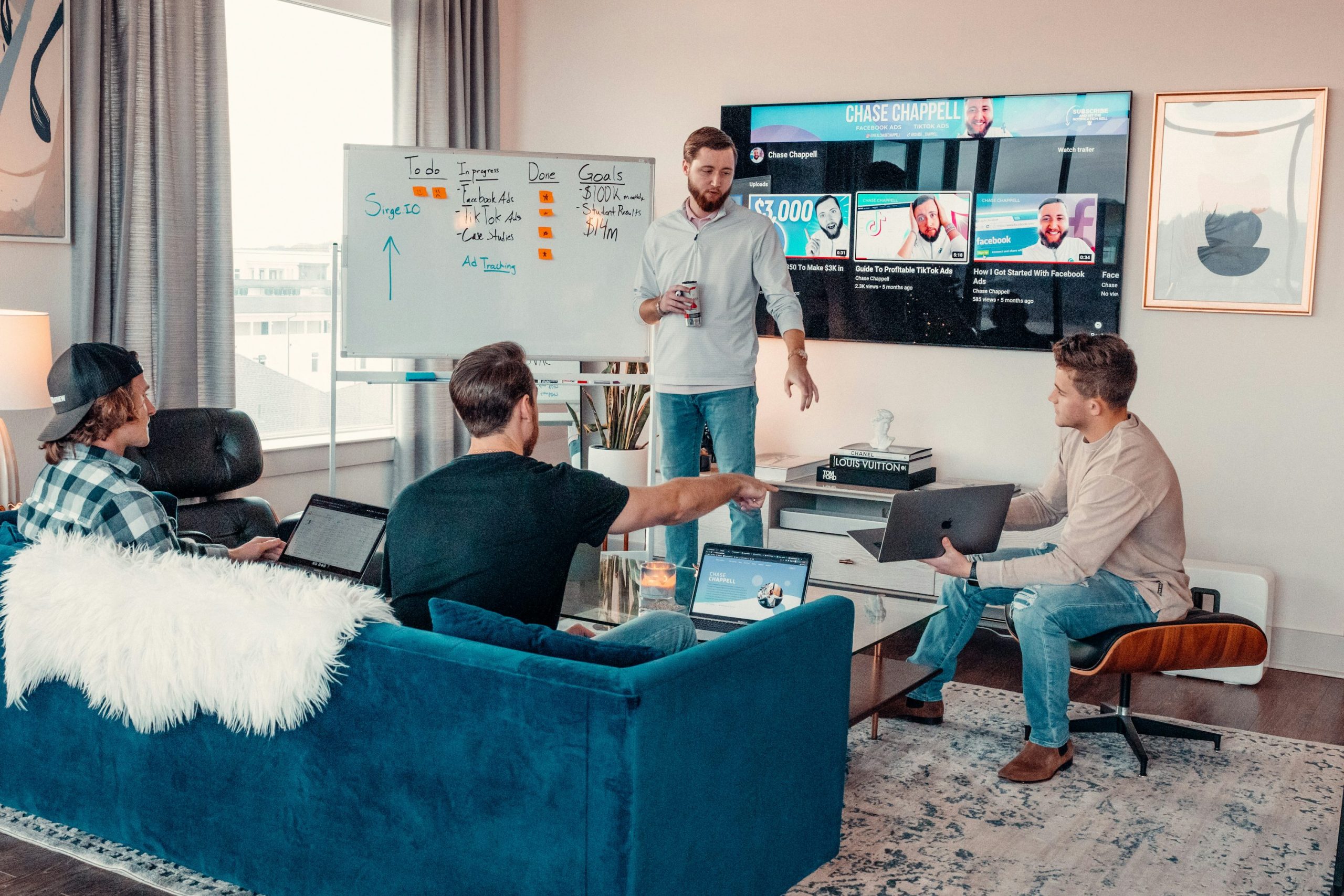 five person by table watching turned on white iMac